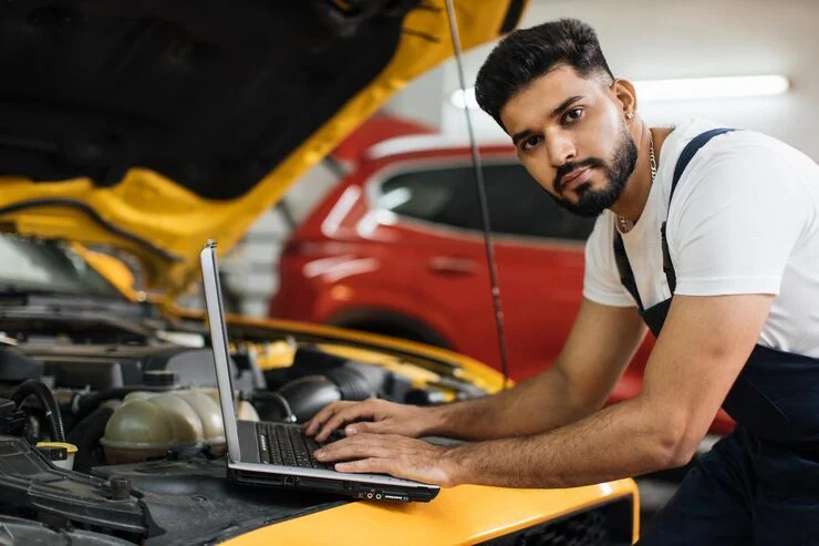 Technician performing fuel injector cleaning service in Dubai service on an engine